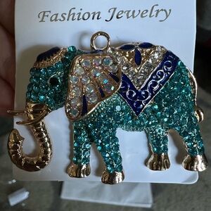 Beautiful rhinestone elephant brooch or ornament.